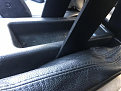 two vertical uprights are not bolted to the center console.pressure fit? and supported by the console just inside of handbrake boot